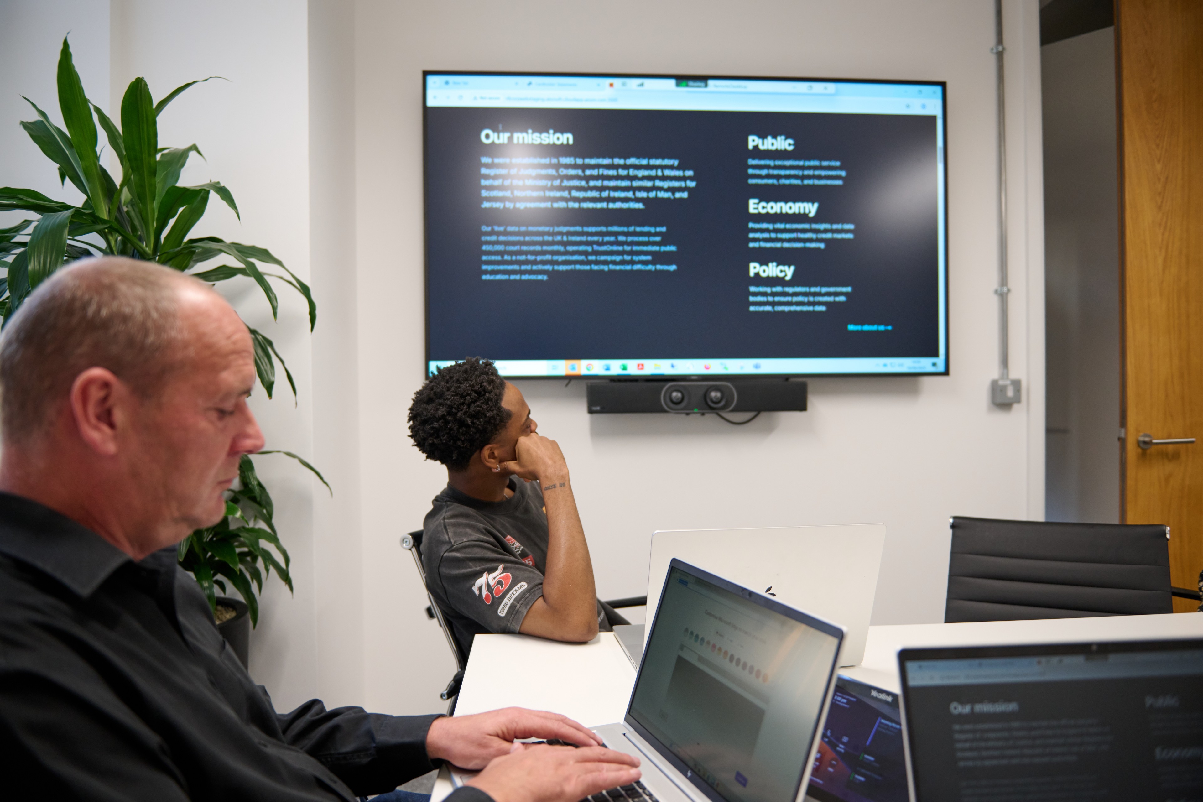 Analysts reviewing judgment data reports and research findings